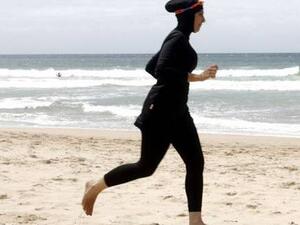 France already has laws in place to prohibit wearing a full-face veil in public or a headscarf in public primary and high schools. (AFP/File)