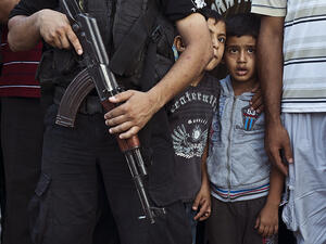 Palestinian boys watch as Hamas militants parade in Shejaiya, Gaza, following the brutal conflict with Israel in 2014. The highest levels of extremism are in countries experiencing ongoing conflicts, where children are particularly vulnerable to recruitment. (AFP/Roberto Schmidt) Palestinian boys watch as Hamas militants parade in Shejaiya, Gaza, following the brutal conflict with Israel in 2014. The highest levels of extremism are in countries experiencing ongoing conflicts, where children are particularly vulnerable to recruitment. (AFP/Roberto Schmidt)