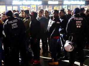 German police monitor people during New Year celebrations at the main train station in Cologne. (AFP/File)