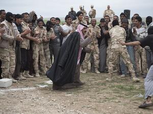 Bedouin volunteers dance as they relax after a day’s training in Iraqi Kurdistan. (Photo/Matt Cetti Roberts)