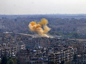 In this photo, smoke rises from reported opposition fire from buildings in an eastern district of Aleppo, Syria. (AFP/File)