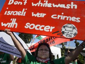 Demonstrators call for the expulsion of Israel from FIFA during a protest rally prior to the opening of the 65th FIFA Congress in Zurich, Switzerland. (AFP/File)