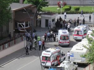 People inspecting the remains of the bombed out car outside Gaziantep police station. (AFP/File)