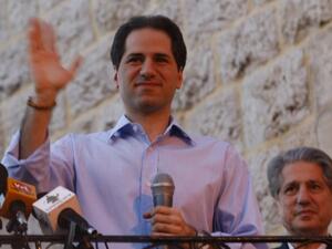 Lebanese Maronite Christian MP Sami Gemayel waves to the crowd. (AFP/File)