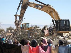 The file photo of an Israeli army bulldozer demolishing a Palestinian home in the West Bank. (AFP/File)