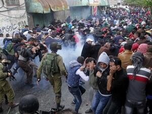 Israeli security forces fire tear gas canisters to disperse Palestinian protesters during a demonstration. (AFP/File)