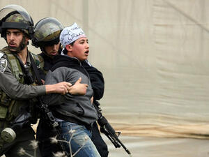 Israeli border police detain a Palestinian demonstrator following clashes at the entrance of the Jalama checkpoint. (AFP/File)