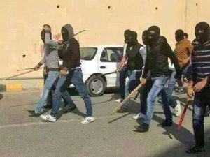 Masked men carrying swords and bats. (File photo)