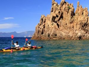 Racers ride kayaks during the 20th Corsica Raid race in Porto on the French island of Corsica. (AFP/Pascal Pochard-Casabianca)