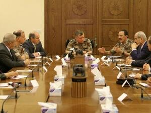 Jordan's King Abdullah II (C) listens to his Military Advisor and Chairman of the Joint Chief-of-Staff General Mishal Al Zaben (C-R) talking during an emergency meeting in the capital Amman after a car bomb on June 21, 2016. (Jordanian Royal Palace/AFP/Yousef Allan)