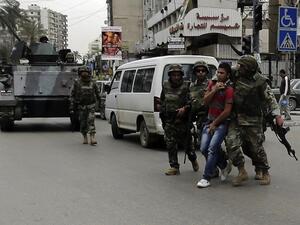 Lebanese army personal arrest a man in the northern Lebanese city of Tripoli. (AFP/File)