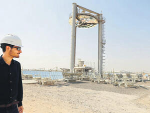 An employee walks at a solar plant in Masdar outside the Emirate of Abu Dhabi. (AFP/File)
