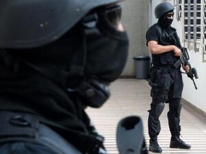 Members of the Moroccan special forces stand guard inside the Moroccan Central Bureau of Judicial Investigation (BCIJ) building on September 14, 2015 in Rabat. (AFP/Fadel Senna) 