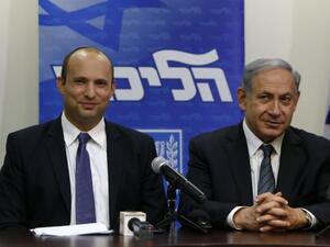 Benjamin Netanyahu (right) and Habayit Hayehudi party leader Naftali Bennett announce a coalition deal on Wednesday. (AFP/File)