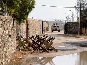 An Egyptian army vehicle patrols along the border with the Gaza Strip in the divided border town of Rafah on November 4, 2014.