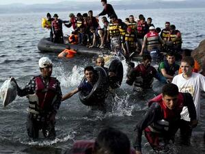 Refugees disembark from lethal dinghy boats after crossing. (AFP/File)