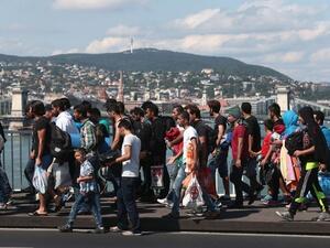 Refugees crossing Hungary. The line of travelers, witnesses say, was nearly half a mile long. (AFP/Ference Isza)