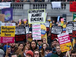 Demonstrators hold banners in support of refugees as they march through central London on March 19, 2016. (AFP/File) Demonstrators hold banners in support of refugees as they march through central London on March 19, 2016. (AFP/File)