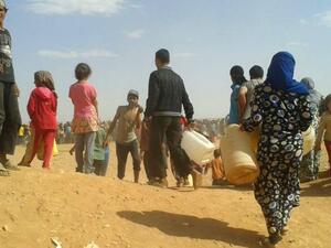 Syrian refugees look for water at the Rukban camp on the Jordanian border. (AFP/File)