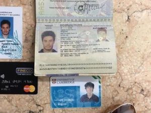 A file photo released by the Egyptian Ministry of Interior on Mar. 24, 2016, showing personal belongings of killed Italian graduate student Giulio Regeni, including his passport, are displayed. (Twitter)