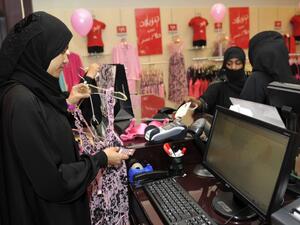 Fully-veiled Saudi women shop at a lingerie store in the Saudi Red Sea port of Jeddah on 2 January 2012. (AFP/File)