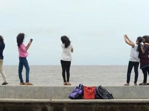 Tourists pose for a selfie. (File photo)