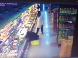 A still image from a video posted on YouTube shows a Saudi woman on the floor after being shoved by an expatriate man. (YouTube)