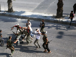 Fighters take to the streets of Aleppo. (AFP/File) Fighters take to the streets of Aleppo. (AFP/File)