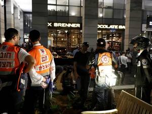 Israeli security forces and emergency personnel are seen at the site of a shooting attack. (AFP/File)