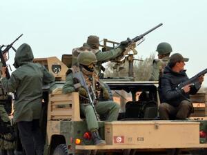 Members of the Tunisian military patrol a road near the Libyan border on March 10, 2016 in Bouhamed, 40 km from the town of Ben Guerdane. (AFP/Fathi Nasri)