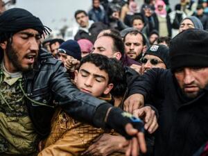 Syrian refugees jostle each other near the Turkish border crossing on February 6, 2016. (AFP/File) Syrian refugees jostle each other near the Turkish border crossing on February 6, 2016. (AFP/File)