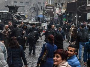 Turkish police performing body checks on people in the street following the New Year bombing. (AFP/File)
