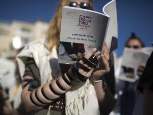 Members of the liberal Jewish religious group Women of the Wall, wearing traditional Jewish prayer garb. (AFP/File)