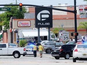 Police officers outside the Pulse nightclub where Omar Mateen opened fire and took hostages on Sunday, June 12. (AFP/Gerardo Mora)