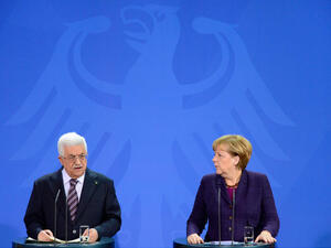 German Chancellor Angela Merkel and Palestinian President Mahmoud Abbas give a press conference on October 18, 12013 at the Chancellery in Berlin .(Image credit: AFP)