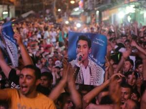 فلسطينون يحتفلون بفوز محمد عساف في رام الله/أ.ف.ب