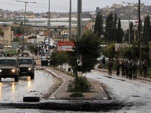  Israeli security forces advancing on the village of Qabatiya, near the West Bank town of Jenin on February 6, 2016. (AFP/Jaafar Ashtiyeh)