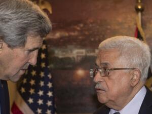 US Secretary of State John Kerry met with PA President Mahmoud Abbas in Amman on Sunday. (AFP / Nicholas Kamm)