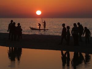 Palestinian children play on the beach in Deir al-Balah in central Gaza on February 13, 2016. (AFP/Mahmud Hams)