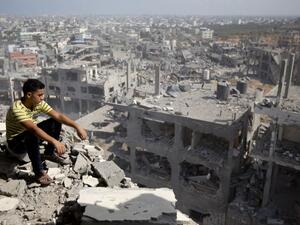 A Palestinian man overlooks destruction in Gaza City's al-Tufah neighborhood, during the second day in a ceasefire on Aug. 6, 2014. (AFP/Mahmud Hams)