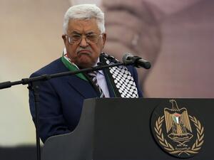 Palestinian president Mahmud Abbas gestures as he gives a speech during a rally marking the 12th anniversary of the death of late Palestinian leader Yasser Arafat in the West Bank city of Ramallah on November 10, 2016. (AFP/Abbas Momani