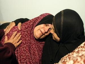 The mother of Omar Maddi, 16, is comforted by a relative as she mourns the death of her son in the al-Mizan hospital in Hebron on February 10, 2016 after he was killed by Israeli security forces in Al-Arroub refugee camp. (AFP/Hazem Bader)