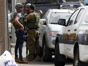 Israeli security forces gather at the site of a reported attack. (Jack GUEZ / AFP)