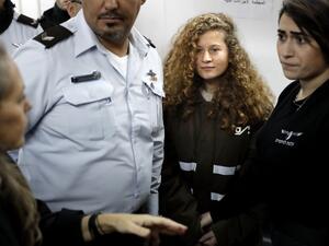 Sixteen-year-old Palestinian Ahed Tamimi stands for a hearing in the Israeli military court on January 15, 2018 (Thomas Coex/AFP)