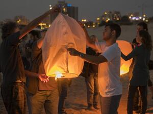 Israeli peace activists gather near the border fence with the Gaza Strip to launch into the air 150 sky paper lanterns in solidarity with Gaza residents on June 19, 2017, in the southern Israeli city of Ashkelon. (Jack Guez/AFP)