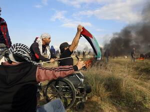 Ibrahim Abu Thuraya protesting shortly before his death on Dec. 15 in Gaza (Mohammed Abed/AFP)