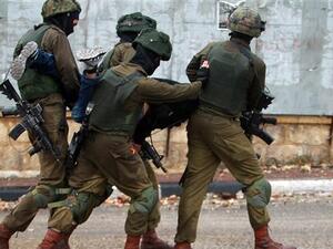 Israeli soldiers carry a Palestinian after he was detained during clashes in the West Bank city of Bethlehem. (AFP/ File)