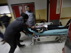 An injured Palestinian man arrives at a hospital to receive treatment following an Israeli air strike in Beit Lahia, in the northern Gaza Strip, on December 8, 2017 (Mohammed Abed/AFP)