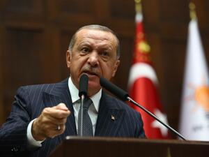 Recep Tayyip Erdogan addresses the crowd during his party's parliamentary group meeting at the Grand National Assembly of Turkey. (AFP/File)