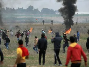 Palestinian protesters clash with Israeli soldiers near the border fence east of Gaza City. (AFP/File)